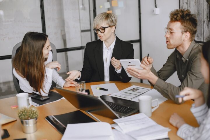 Basecamp employees discussing the 2021 political speech policy in a conference room