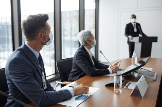 IBM employees collaborating in a hybrid office setting during a strategy meeting