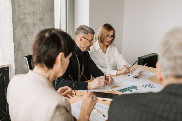 Microsoft employees collaborating in a modern office during a cultural transformation initiative