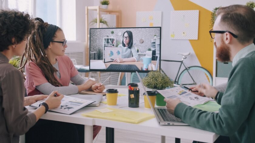 GitLab employees collaborating remotely, illustrating the handbook‑first culture